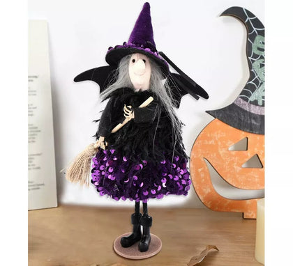 Adorno Bruja lila con Escoba 25 cm