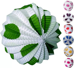 White lantern with large polka dots in various colors