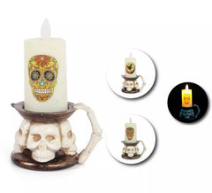 Halloween candle with skull base in assorted models with light measuring 9.3x14.3 cm